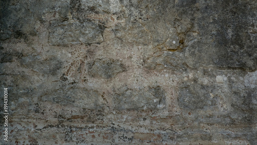 Stone wall background with ancient stonework. Close-up of a dilapidated stone wall