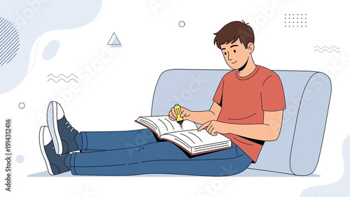 Young man relaxing on couch reading book, studying, and learning