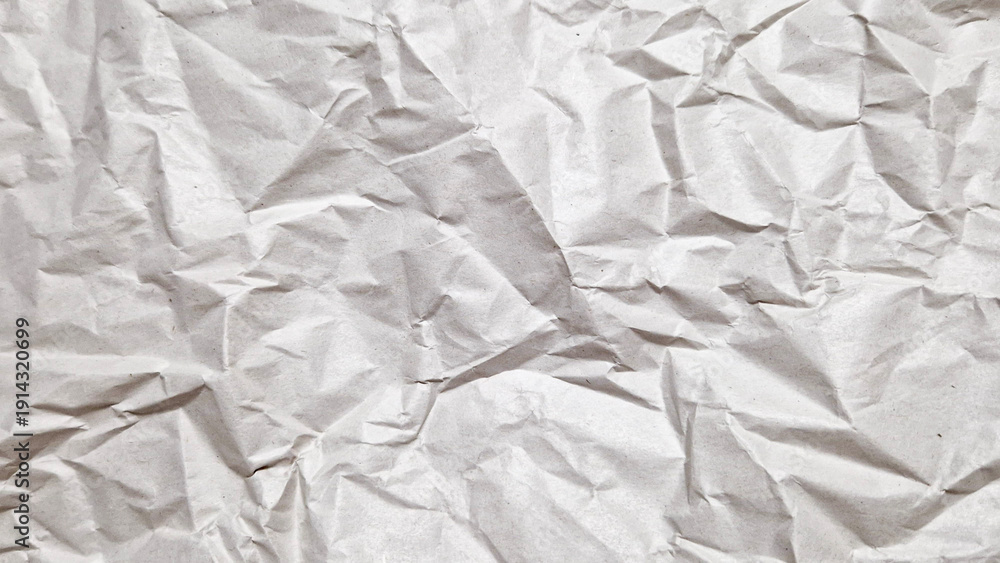 Obraz premium Top view of wrinkled paper surface for mockup and design background
