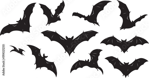 A group of bats flying in the night sky with a full moon.