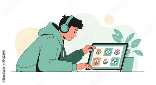 Young Man with Headphones Designing Flowers on Laptop
