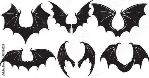 A collection of various bat silhouettes in different flight positions and angles