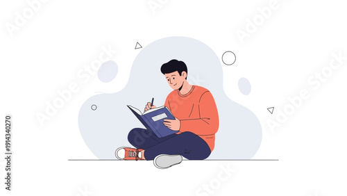 Young man sitting on floor writing in a notebook, studying, working, creative process