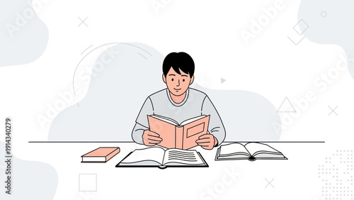 Young Man Reading Books at Desk, Studying and Learning Concept