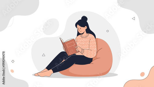 Young Woman Reading Book Sitting on Bean Bag Chair, Cozy Home Relaxation