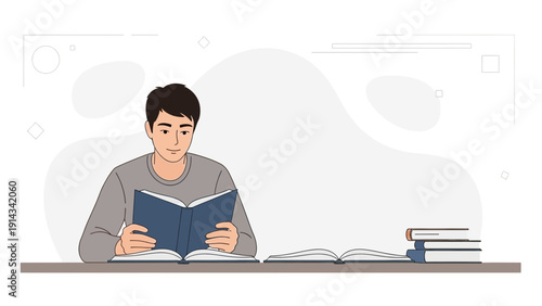 Young Man Reading Book at Desk with Stack of Books