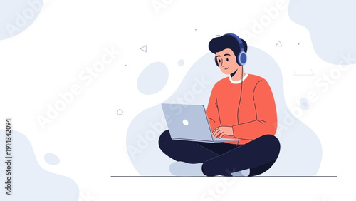 Young man with headphones working on laptop, studying and listening to music