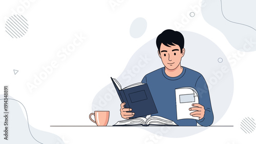 Young man reading a book and holding a notebook, with a mug on the table