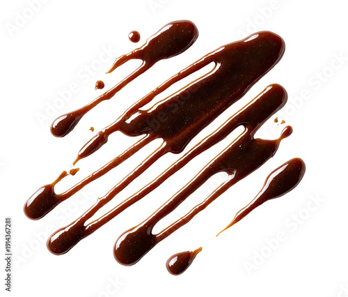 Diagonal streaks of glistening, dark brown sauce against a stark black background, appearing viscous