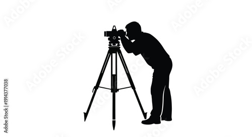 Surveyor operating a theodolite on a tripod stark silhouette