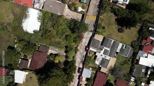 Top down aerial of Fraijanes Guatemala neighborhoods and homes in rural area in dry season