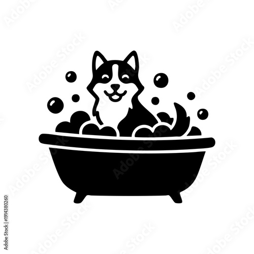 Dog sitting in bathtub with water droplets
