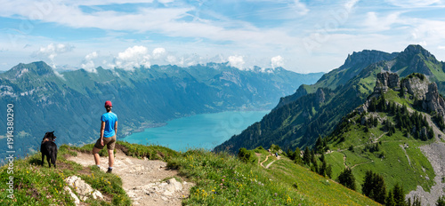 Wallpaper Mural A hiker enjoying a scenic view on lake Brienz seen from Schynige Platte Torontodigital.ca