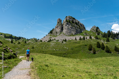 Wallpaper Mural A woman taking a walk on the Schynige Platte, Mount Loucherhorn in the background Torontodigital.ca