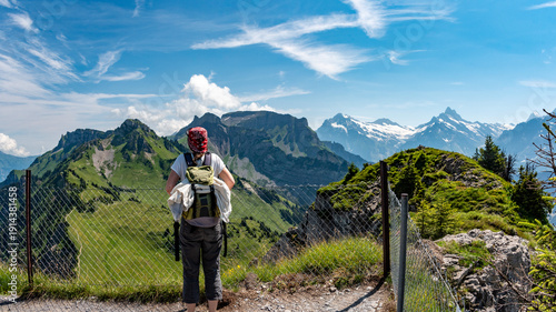 Wallpaper Mural A hiker enjoying the panoramic view on the Bernese alps seen from Mount Loucherhorn on the Schynige Platte Torontodigital.ca
