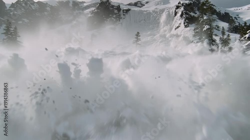 Massive snow avalanche crashing down mountain slope