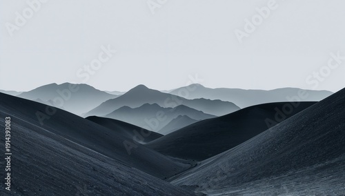 Mountains in Different Shades of Gray Create a Layered Landscape During the Day