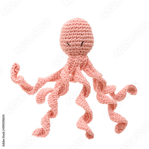 Pink plush octopus handmade using the amigurumi crochet technique, isolated on a transparent background.