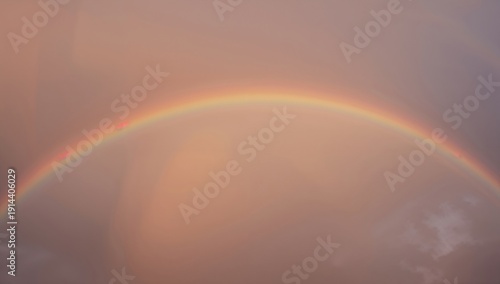 Rainbow Arches Across the Sky After a Light Rain in the Evening