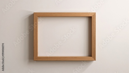 Wooden Picture Frame Hangs on White Wall Without Any Art Inside