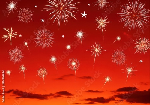 Vibrant fireworks illuminating the night sky with a stunning red backdrop