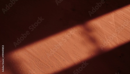 Sunlight Casts Shadows on a Textured Surface in a Warm Indoor Setting During ...
