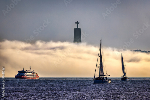 Slika na platnu Christ the King Monument Emerging from Fog Over Tagus River