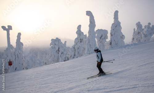 Woman downhill skiing in Lapland Finland