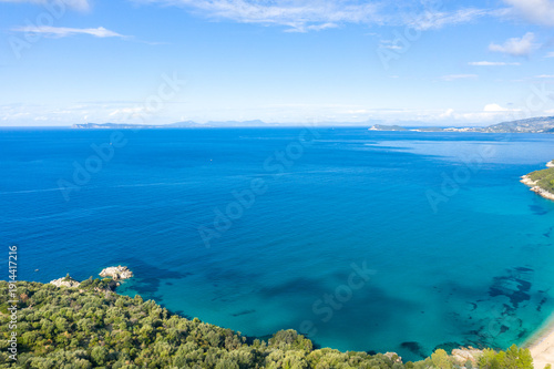 Cuadro en lienzo Vast expanse of the Ionian Sea with vibrant blue water and a lush green coastline in the foreground