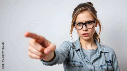 Young caucasian woman wearing casual clothes and glasses pointing displeased and frustrated to the camera, angry and furious with you