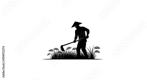 Silhouette of Farmer Working in Rice Field with Harvesting Tool