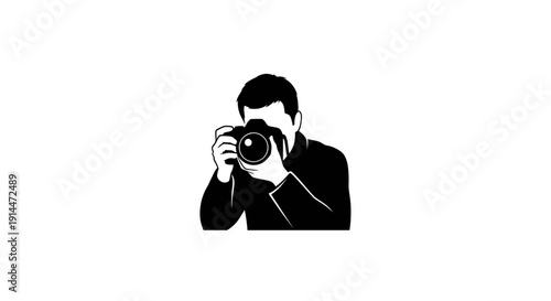 Professional Photographer Holding Camera in Studio