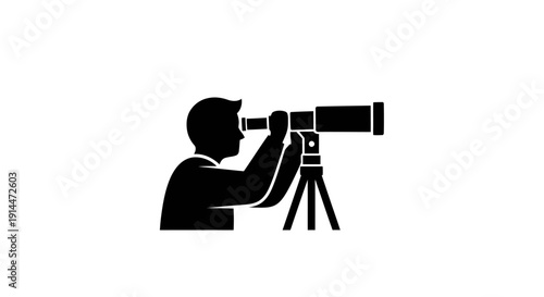 Silhouette of a Photographer Using a Camera on Tripod