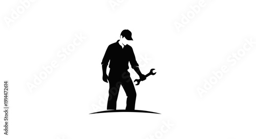 Silhouette of a Man Holding Wrench in Standing Position