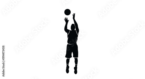 Silhouette of a basketball player shooting ball in mid-air