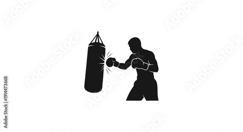 Silhouette of a boxer hitting a punching bag in training