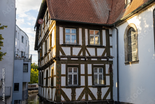 Spitalkirche St. Katharina along the Wiesent River in Forchheim, Bavaria, Germany old town architecture and Franconian heritage.