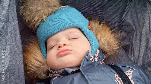 Close up of cute sleeping baby boy in stroller