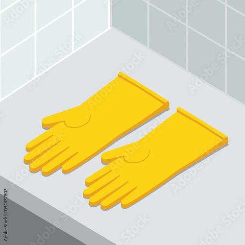 Pair of yellow rubber gloves on a grey countertop in a tiled bathroom.