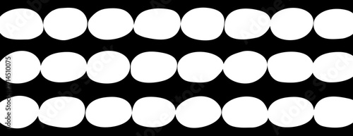 Black background with white oval patterns. The background is bold and graphic, featuring a repetitive black and white design. Cute pattern background vector. Black background.
