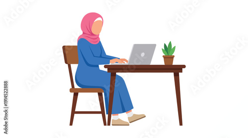 Woman in Hijab Working on Laptop at Desk