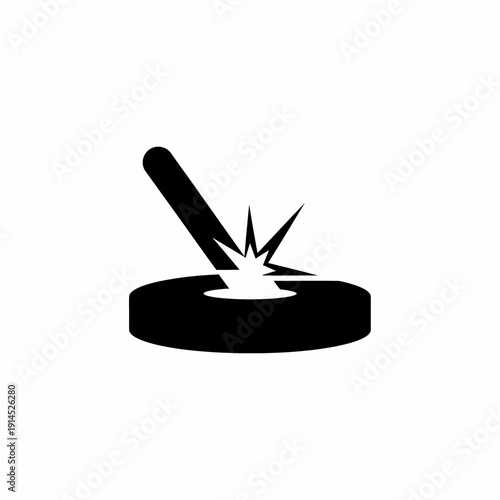 Black and white icon of a metal piece being struck by a tool with sparks flying