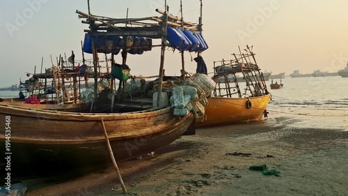 Fishing boats in Chittagong sail across the vast waters of the Bay of Bengal, carrying local fishermen who depend on the sea for their livelihood.