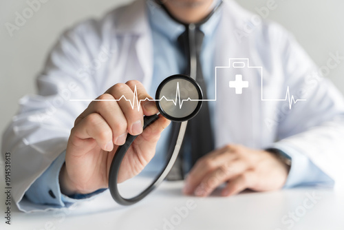 Photography Doctor holding stethoscope with heartbeat line for health monitoring concept