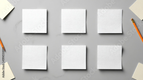 Wallpaper Mural Six blank white square papers on marble desk with pencils and erasers, creative workspace concept Torontodigital.ca
