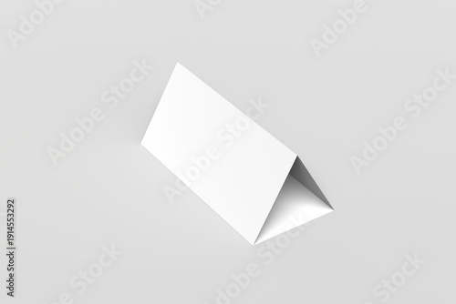 Minimalist blank white tent card mockup in a triangular folded shape, standing on a clean neutral background. Perfect for showcasing table name cards, restaurant menus, event signage, promotional.
