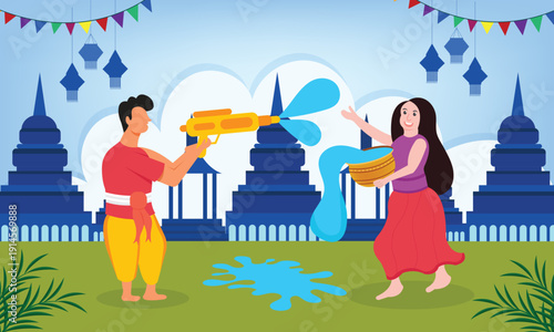 Man and Woman celebrate the Songkran festival by playing with water guns in front of traditional Thai temple pagodas