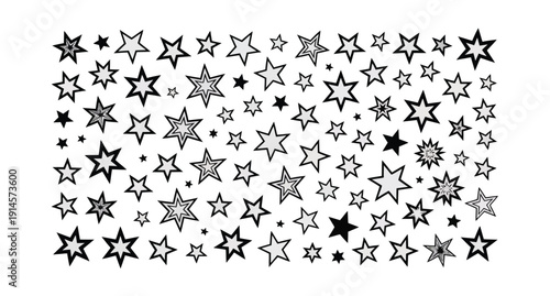 Collection of diverse black and white outlined and solid stars scattered randomly across a light grey background surface for decoration