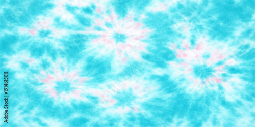 A beautiful abstract blue background features bright sunlight and white clouds scattered across a clear summer sky, blending nature and space into a heavenly high-altitude view