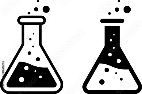 Laboratory flasks with bubbling liquids in black and white